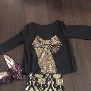 Black with gold bow in the back long sleeve shirt